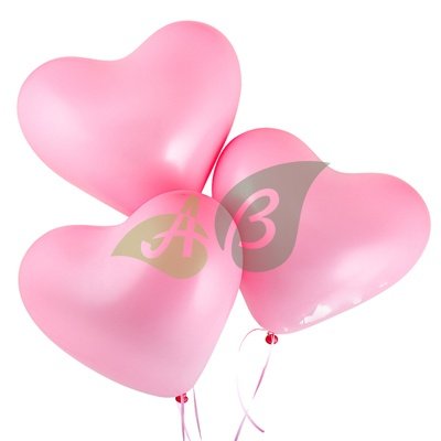 Розовые воздушные шарики в форме сердца
